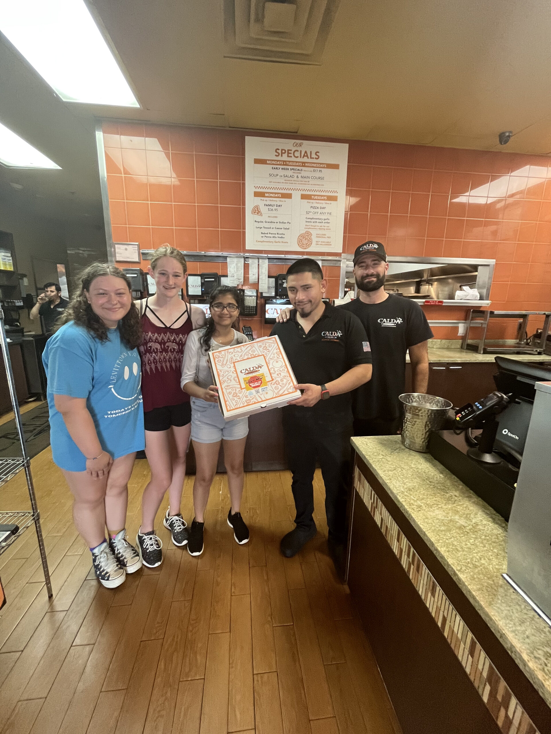 Students visit local pizzeria with prevention resources